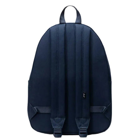Navy blue backpack on a gray background