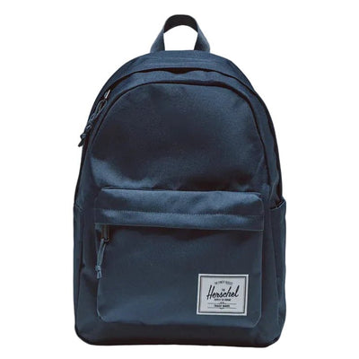 Navy blue backpack with a visible brand logo on a gray background